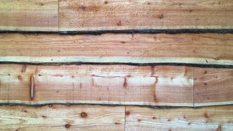 Close up of rustic waney edge wooden boards shed facade. 4k high quality video. Stock Footage 170090529