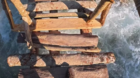 Close-Up of a Rustic Wooden Footbridge Over a River 스톡 동영상 340278033