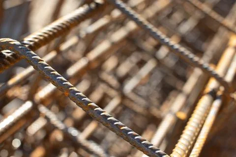 Close up of rustry steel construction grid in low solar angle for cementation Foto stock