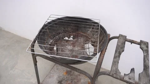 Close up of a rusty and hollow but still functional grill on a rooftop in the 库存影片 155781452