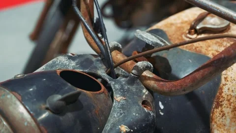 Close-up of rusty antique motorbike engine in indoor garage Video stock 340880454