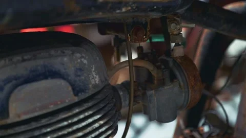 Close-up of rusty antique motorcycle engine components in exhibition space Stock Footage 340880430