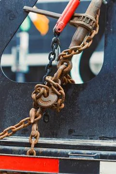 Close-up of rusty chains and metal hook on a construction site Stock Photos