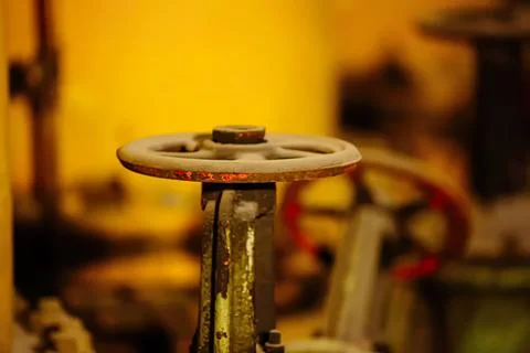 Close-up of a rusty fire hydrant valve in a city street Stock Photos