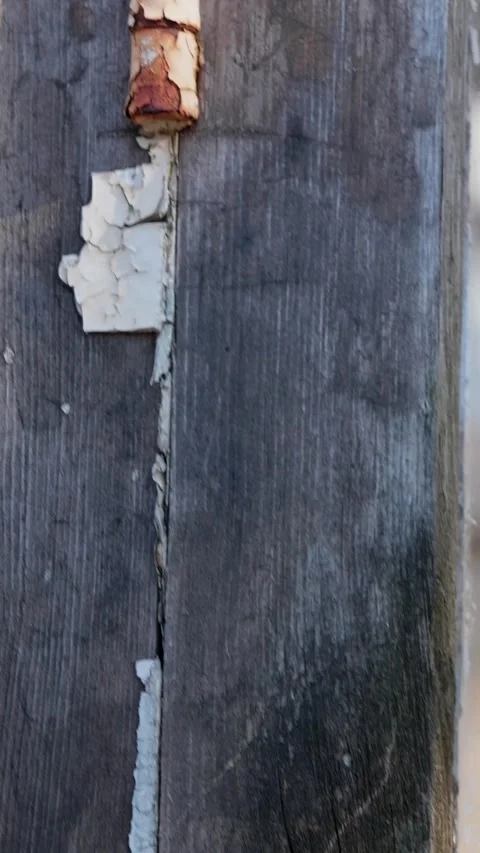 Close-up of rusty hinges with cracked old paint, wooden window frames Stock Footage 265400839