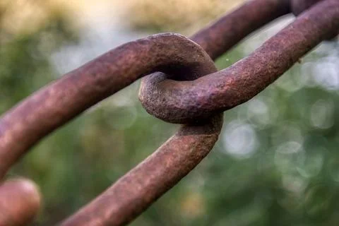 Close up a rusty iron chain or the interlocking steel rings Stock Photos
