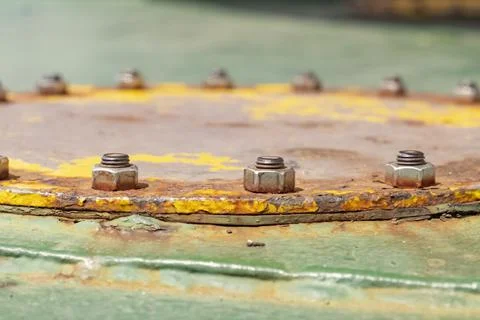 Close-up of rusty metal nuts holding the hull of the vessel. Metal fastening of Stock Photos