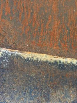 Close-up of rusty metal surface with peeling paint Stock Photos