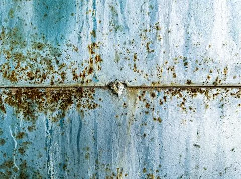Close-up of Rusty Metal Surface with Weathered Texture and Corrosion Patterns 库存照片