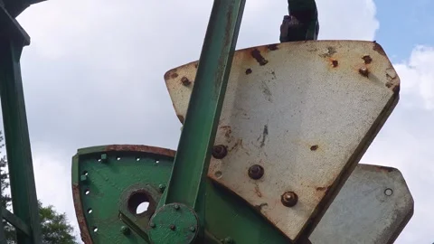 Close up of a rusty old oil pump jack mechanism extracting crude oil in nor.. Stock Footage 343249225