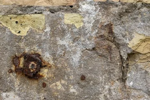Close-up of a rusty plate on an old brick wall, texture Stock Photos