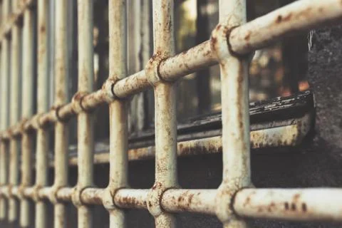Close up of rusty security grids on a window Stock Photos