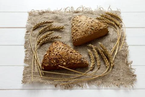 Close up rye multigrain bread on wood white baackground Stock Photos