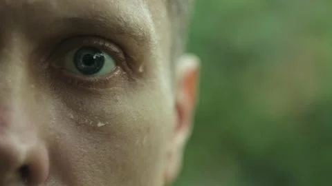 Close-up of a sad and exhausted man standing in the rain, expressing feelings of Video stock 295210669