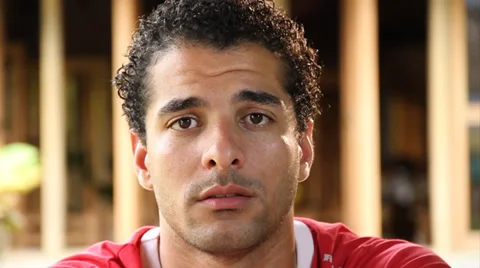 Close up of sad young man looking at camera Stock Footage 38759313