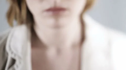 Close-up of a sad/nervous woman Stock Footage 1079029