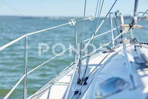 Close up of sailboat or sailing yacht deck in sea Stock Photos