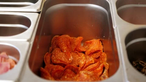 Close-up of salami sausage in a container in a professional pizzeria kitchen. Stock Footage 307388645