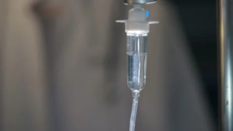 Close up saline IV drip Infusion bottle with IV solution for patient in ward Stock Footage 134703222