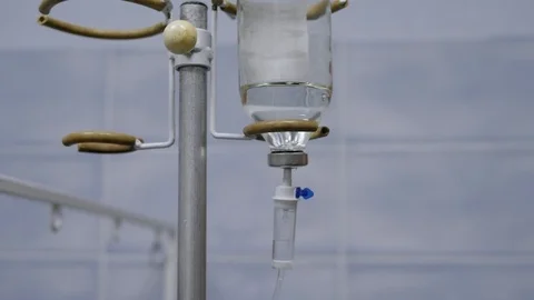 Close-up saline solution drip for patient in hospital. Medicine. Stock Footage 127965941