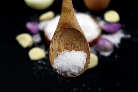 Close up salt on the spoon 写真素材