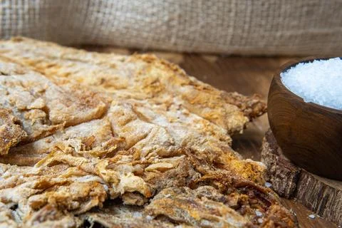 Close-up of salted cod next to grains of salt. Ingredient for fanesca Stock Photos