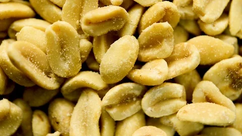 Close up of salted peanuts rotating. Flat plane. Top view Vídeos de archivo 104640971
