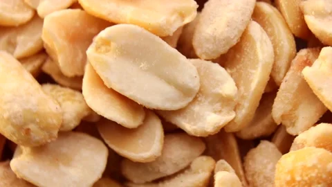 Close up of salted peanuts, rotation in circle. Turning nuts. Stock Footage 233116833