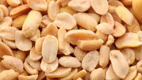 Close up of salted peanuts, rotation in circle. Turning nuts. Video stock 234119882