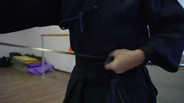 Close-up, Samurai Hands Insert into Katana's Sword's Sword Stock Footage 85952171