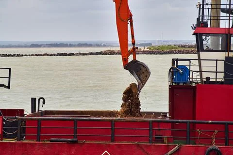 Close up of sand and mud being loaded into a ship's hopper Stock Photos