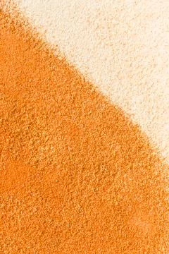 Close up sand background. Texture of white and yellow sands Stock Photos