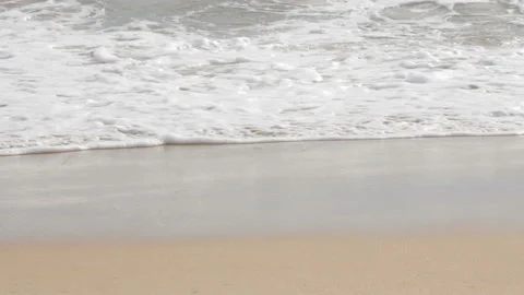 Close up sand beach  ground floor, sea wave hit shore Stock Footage 132800219