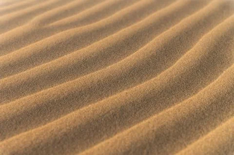 Close-up of sand dunes with rippled texture in desert landscape Stock Photos