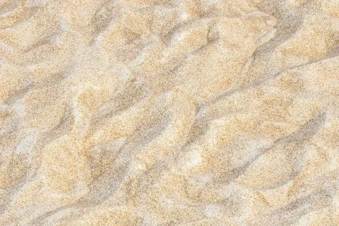 Close up of sand pattern background on beach near sea in summer Stock Photos