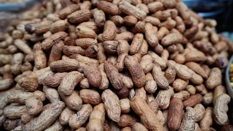Close-up of sand-roasted peanuts in a pile Stock Footage 320958620