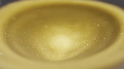 Close up of sand timer clock with sand flowing from through hourglass. Stock Footage 311091299