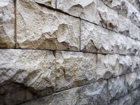 Close-up of sandstone wall featuring textured stone block Stock Photos