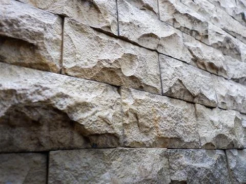 Close-up of sandstone wall featuring textured stone block Stock Photos