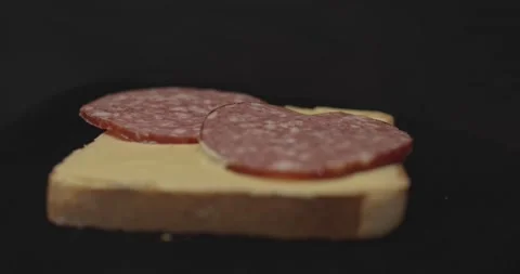 Close up of Sandwiches on black background Stock Footage 130741012