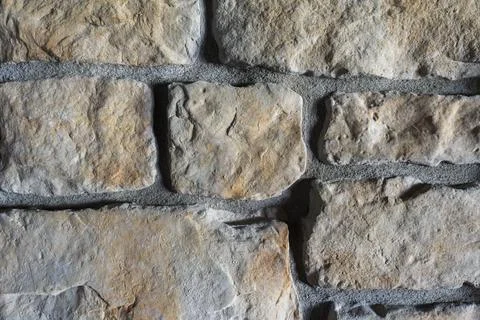 Close-Up of Sandy Beach Cobblestone Wall Texture with Natural Stone Pattern Stock Photos