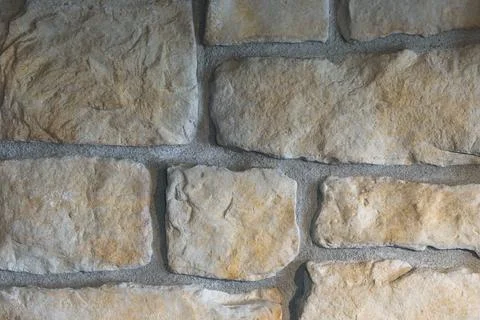 Close-Up of Sandy Beach Cobblestone Wall Texture with Natural Stone Masonry Stock Photos