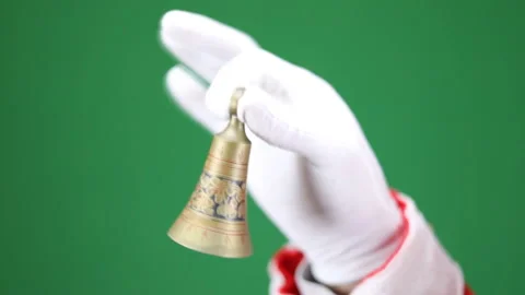 Close-up, Santa Claus hand ringing a small bell in slow motion Stock Footage 166319756