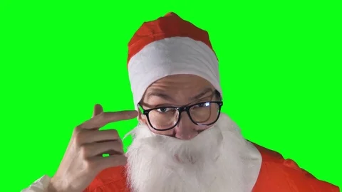 A close-up on Santa Claus raising brows on a green background. Stock Footage 82258299