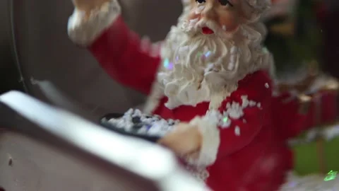 Close-up of Santa in snow globe. Macro video of toy santa. Christmas mood. Stock Footage 225862346