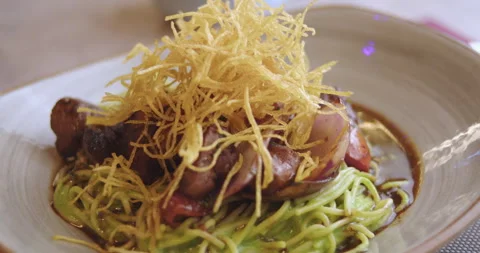 Close-Up of Sautéed Loin with Pesto Spaghetti – High-Definition Culinary Footage Stock Footage 291102995