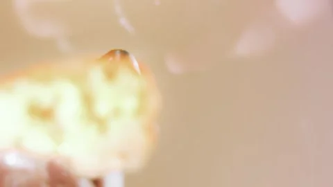 Close-up of savory topping falling into an open hot dog, 4K Stock Footage 341122008
