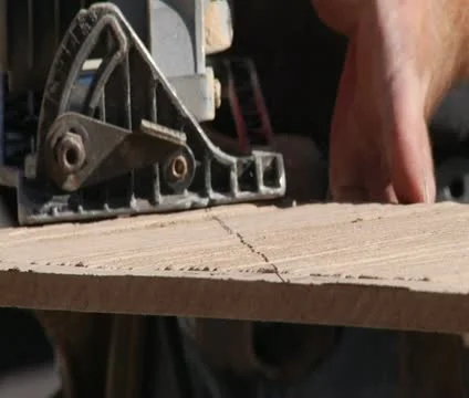 Close-up on saw cutting wood Stock Footage