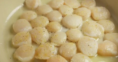 Close-up of scallops being turned to achieve an even golden sear, homemade Vídeo Stock 327164476