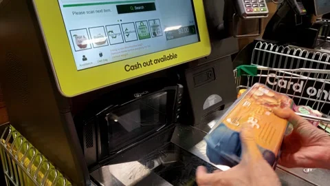 Close-up of scanning a shopping item through a checkout machine Stock Footage 301569028